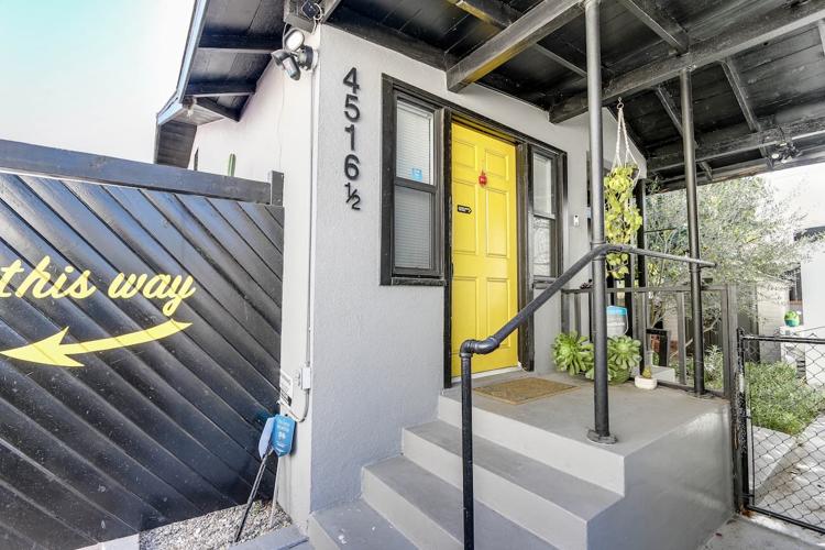Front steps leading to office entrance with yellow door