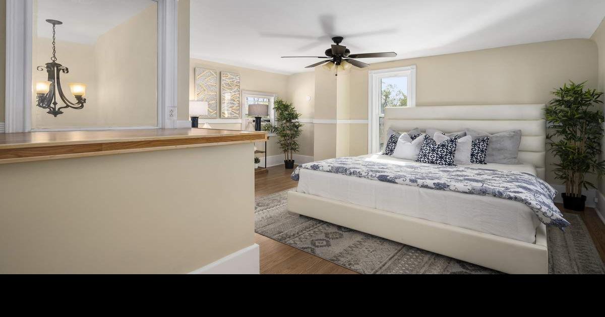 Bed under ceiling fan in bedroom 1003 Monterey Road Sponsored
