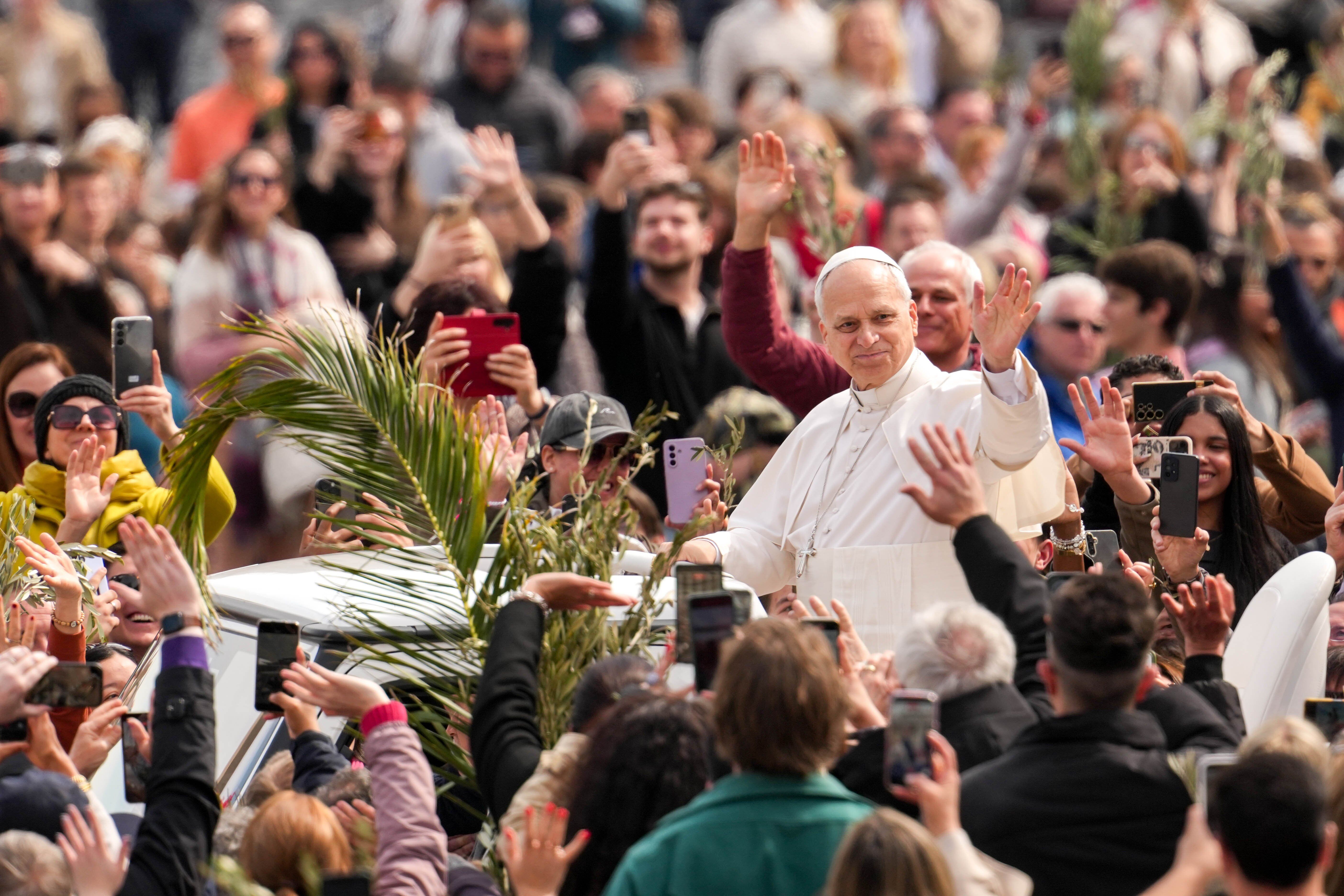 "Lay down your weapons," pope says in Palm Sunday call for peace