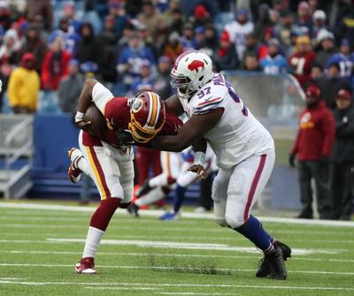 McCoy-Sports-Bills-Buffalo Bills defensive tackle Jordan Phillips (97)-Washington Redskins quarterback Dwayne Haskins (7)-Washington-2019 (copy)