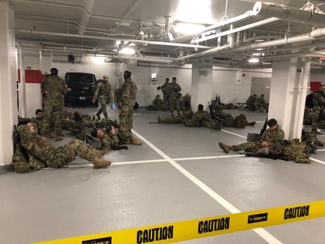 U.S. National Guard soldiers moved to parking garage