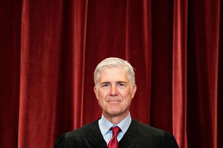 Associate Justice Neil Gorsuch stands during a group photo of the Justices at the Supreme Court in Washington, DC on April 23, 2021.