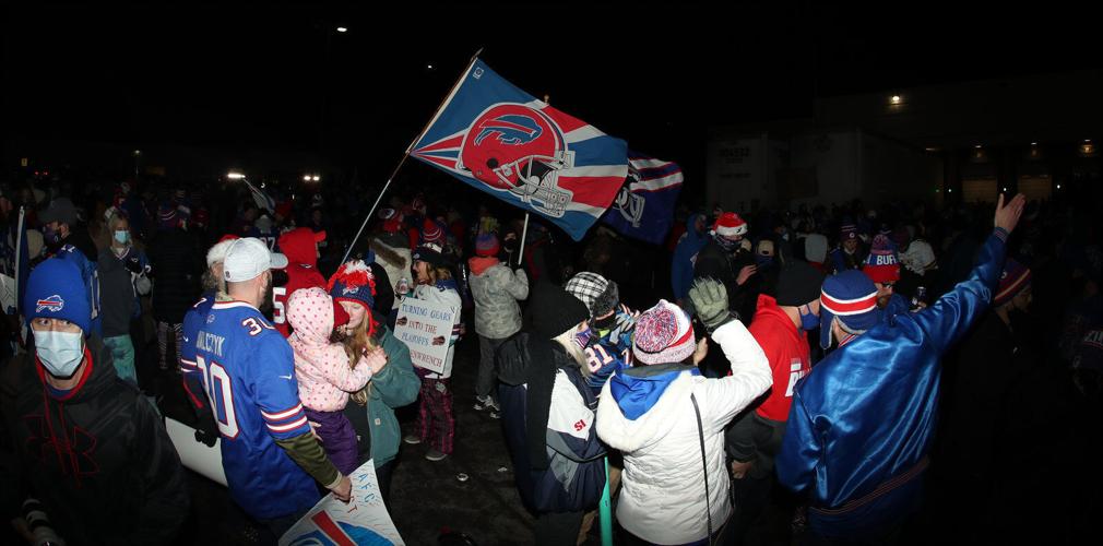 Thousands of adoring fans greeted the Bills at the airport after winning the AFC East title