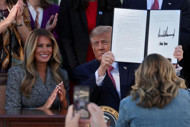 FILE PHOTO: US President Trump signs an executive order on women's health, in Washington, DC