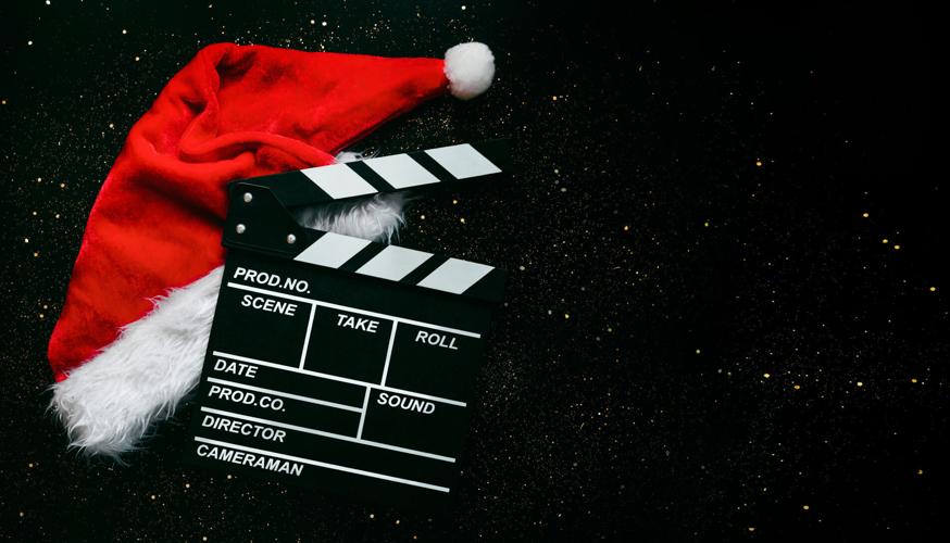 Movie clapperboard with Santa's hat  -- Christmas movies