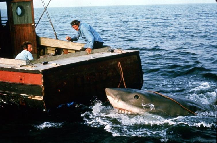 Hooper (Richard Dreyfuss, far left) and Quint (Robert Shaw) battle a shark in "Jaws."