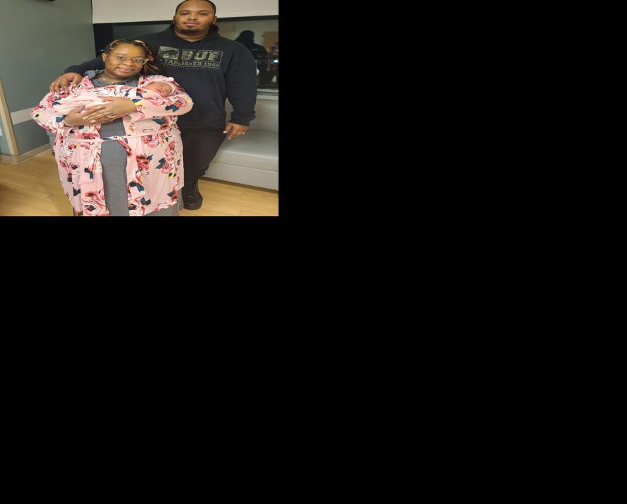 Erica and Davon Thomas with their baby girl, Devynn