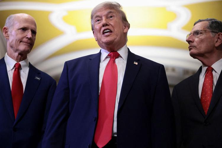 U.S. President Trump walks with Senate Majority Leader John Thune (R-SD) to the Senate Republican Steering Committee lunch, in Washington