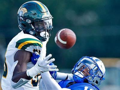Hampton's Byron Perkins, right, disrupts a pass intended for Norfolk State's Da'Quan Felton during a game earlier this season.