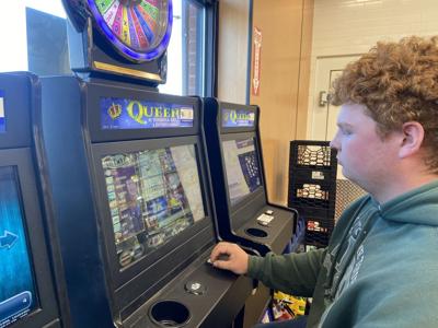 Zach Smith plays a skill game at a 7-Eleven in Henrico County.