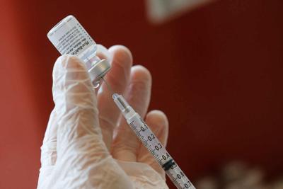 Masked and mostly vaxxed, college students return to in-person classes
