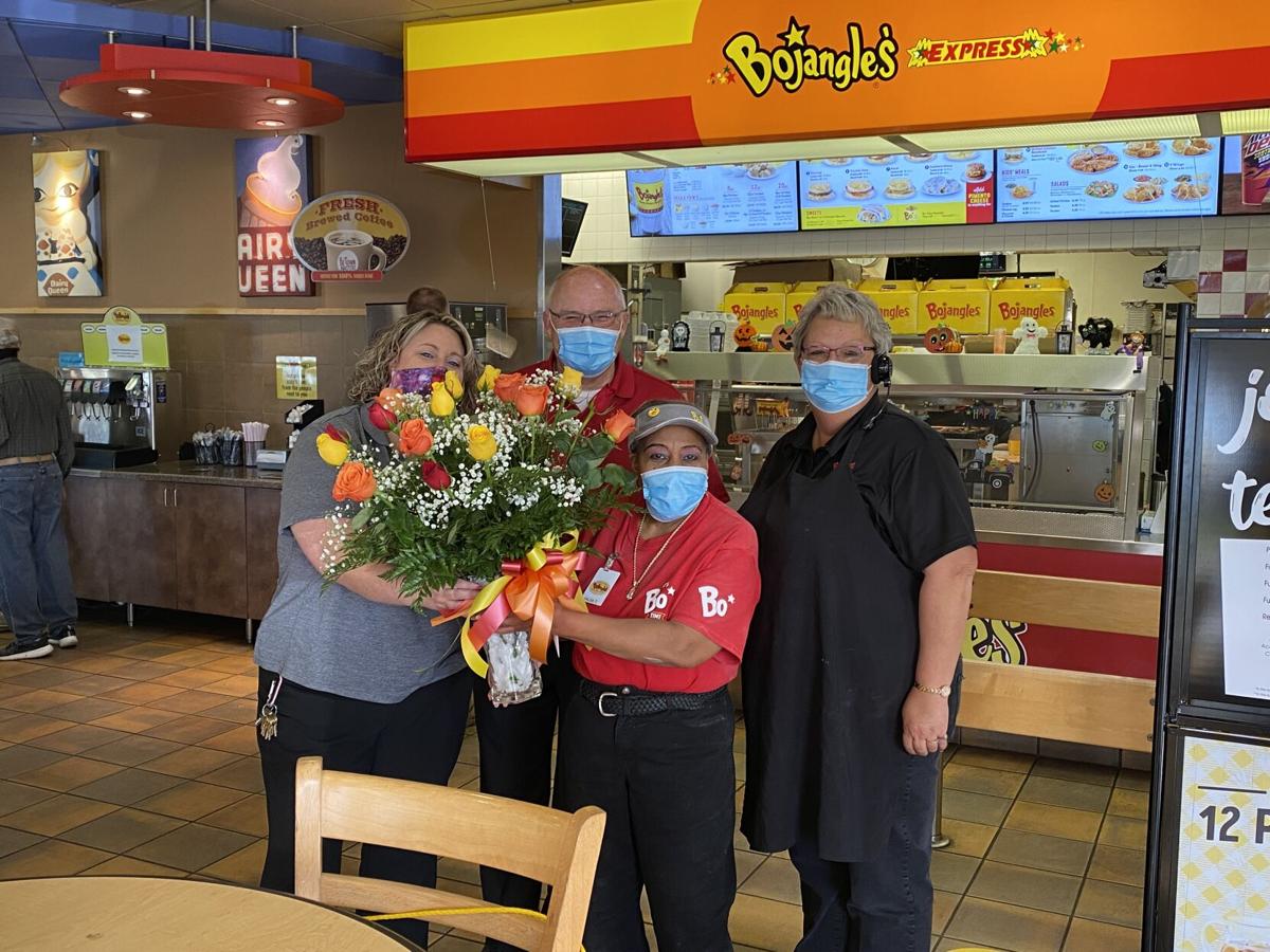 Bojangles employee hangs up her apron