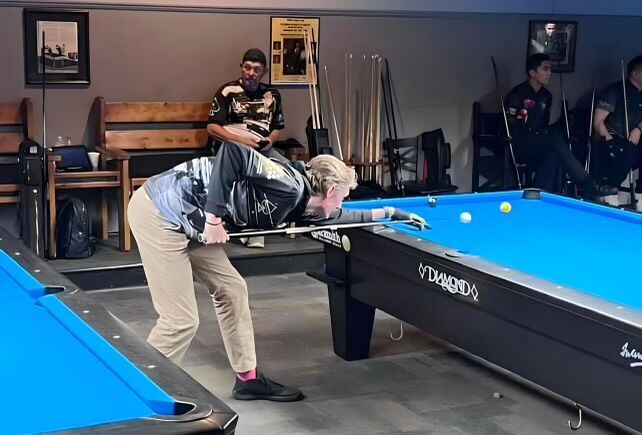 Nester playing pool