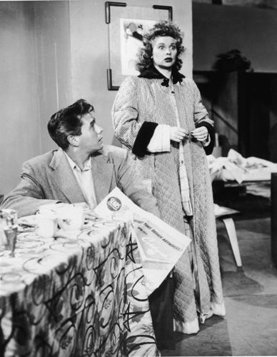 Lucille Ball, right, and Desi Arnaz talk to each other in a still from the television series, "I Love Lucy," 1956..