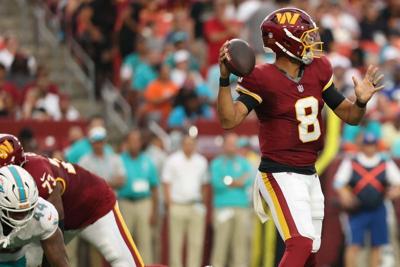 Washington Commanders quarterback Marcus Mariota (8) passes the ball against the Miami Dolphins during the first half at Northwest Stadium in Landover, Maryland on Aug. 14, 2026.