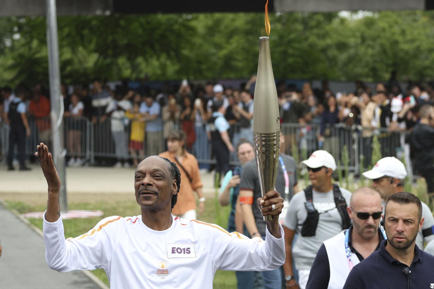 Snoop Dogg carries Olympic torch before Games open in Paris