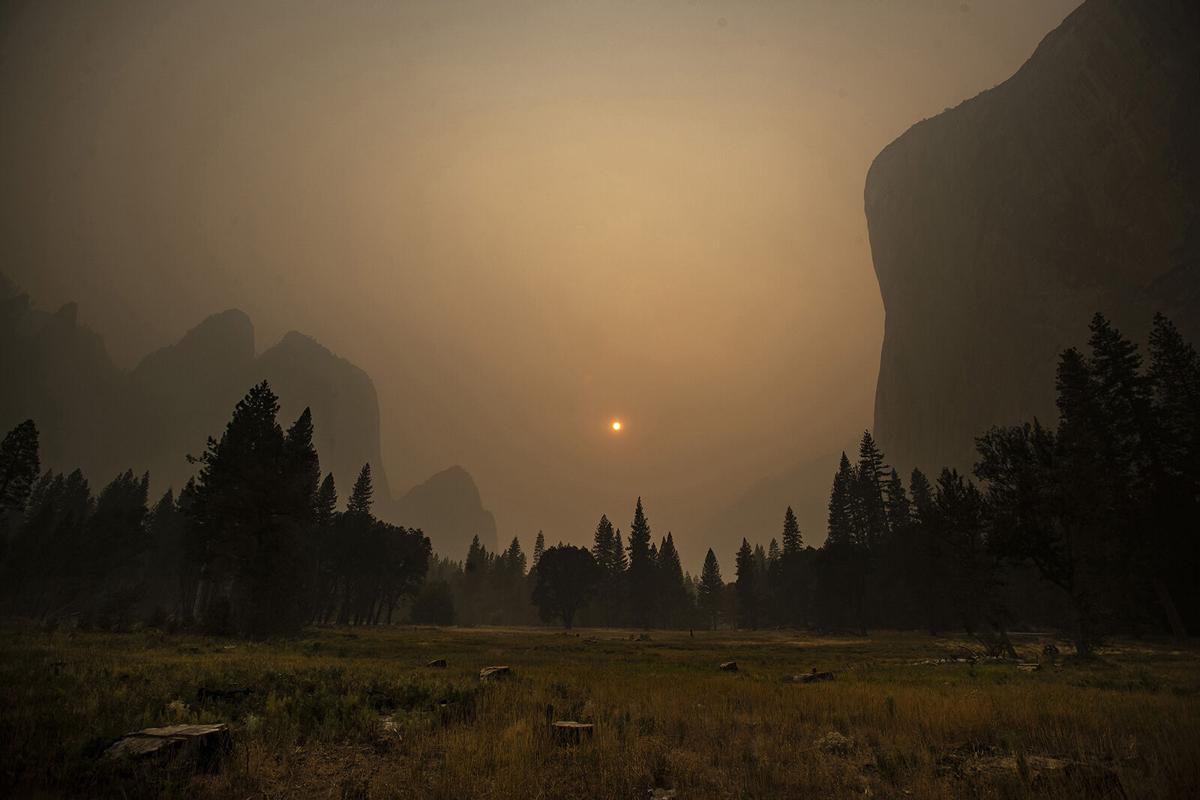 Thick smoke from multiple forest fires shrouds iconic El Capitan, right, and the granite walls of Yosemite Valley on Sept. 12, 2020, in Yosemite National Park, California.