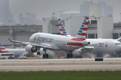 A man was apprehended after damaging a plane during boarding process, American Airlines says