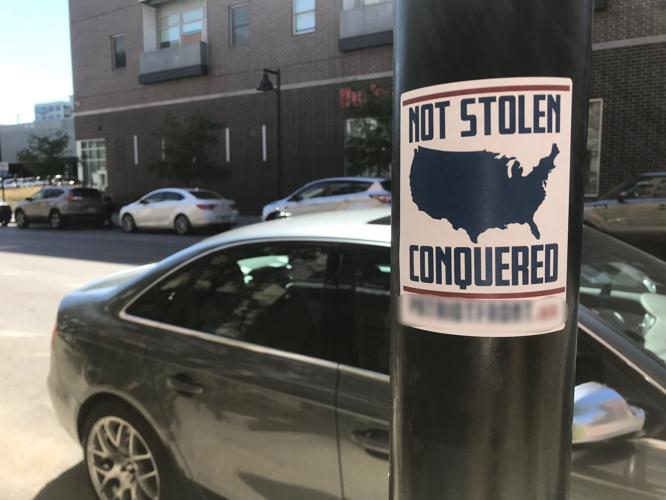 Patriot Front, a white nationalist group born from leaders of the deadly "Unite the Right" rally, posted propaganda in downtown Des Moines.