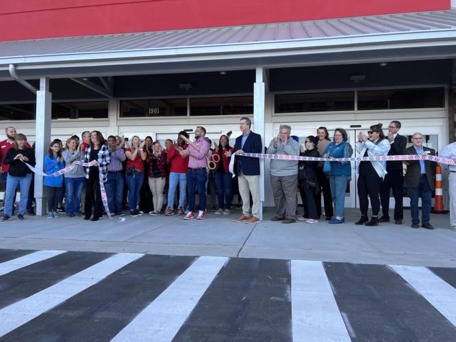 Target officials and the Outer Banks Chamber of Commerce cut the ceremonial ribbon on Sunday, April 2, 2023, for the opening of the Kill Devil Hills Target store.