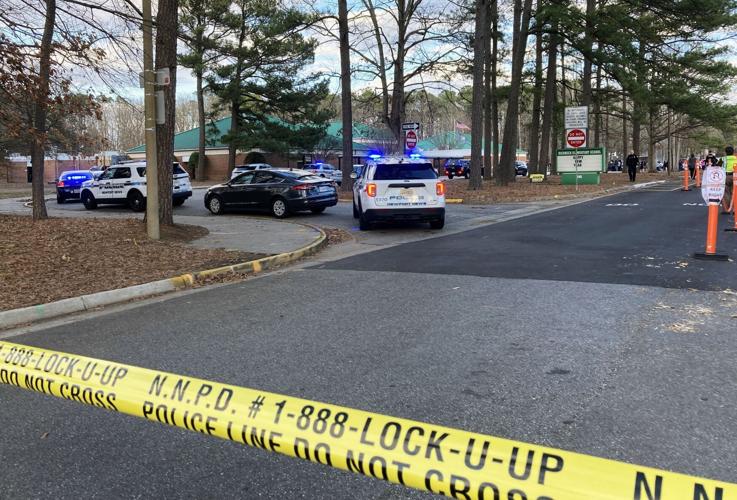 Police crime scene tape blocks access to Richneck Elementary School on Jan. 6. The students are still in the building while police vehicles line up outside.