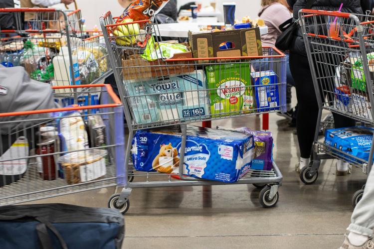Shopping carts sit full of groceries May 14, 2025, at a Costco store in Tigard, Ore.