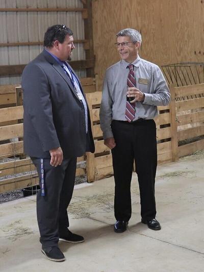 FCHS teacher C.D. White (left) speaks with Jason Powell, Ferrum College