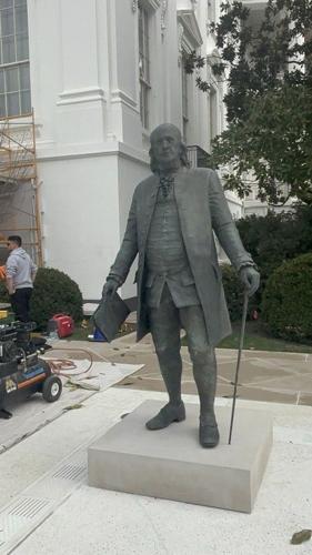 A statue of Ben Franklin in the Rose Garden.