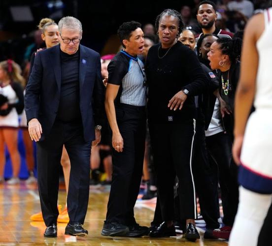 South Carolina head coach Dawn Staley (right) yells at Connecticut head coach Geno Auriemma at Mortgage Matchup Center during the Women's Final Four in Phoenix on April 3, 2026.