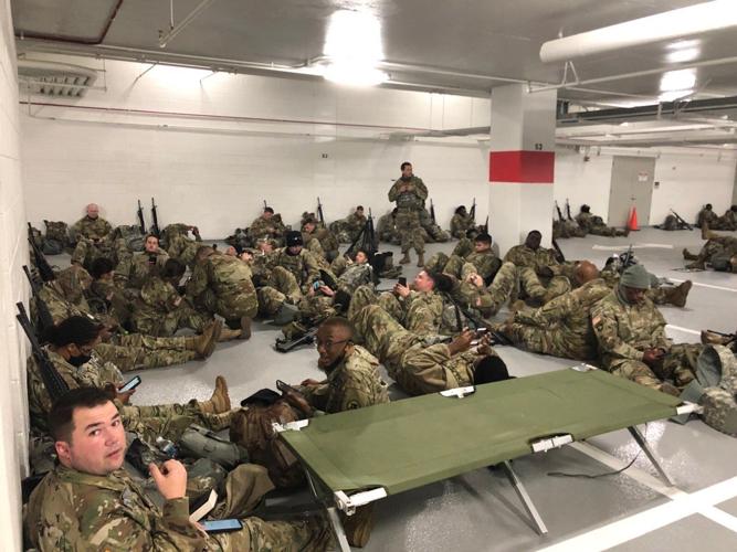 U.S. National Guard soldiers moved to parking garage