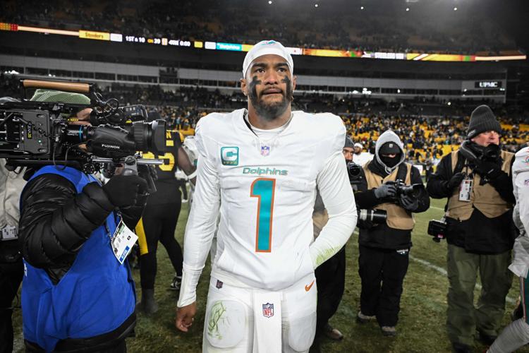 Dec 15, 2025; Pittsburgh, Pennsylvania, USA; Miami Dolphins quarterback Tua Tagovailoa (1) leaves the field following a game against the Pittsburgh Steelers at Acrisure Stadium. Mandatory Credit: Barry Reeger-Imagn Images