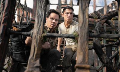 Mark Wahlberg, left, and Tom Holland in "Uncharted."