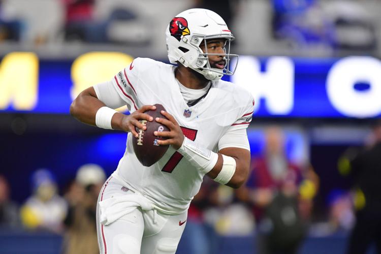 Arizona Cardinals quarterback Jacoby Brissett (7) rolls out against the Los Angeles Rams during the second half at SoFi Stadium.