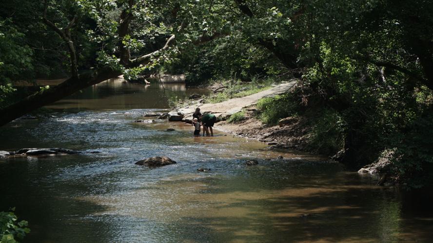Children play in Pigg River at Lynch Park