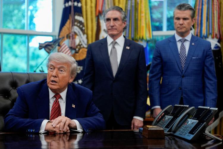 FILE PHOTO: U.S. President Donald Trump signs executive orders at the White House in Washington