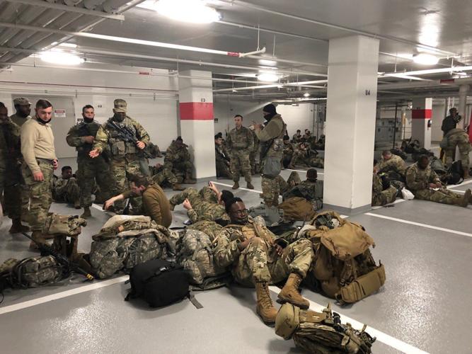 U.S. National Guard soldiers moved to parking garage