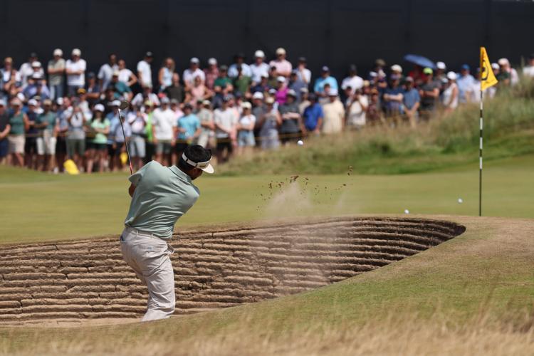 Jason Day plays a shot from a bunker on the 13th hole during the first round of The Open Championship 2026 at Royal Birkdale.