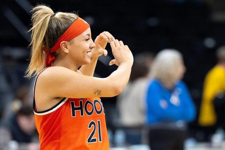 Virginia guard Kymora Johnson (21) shows a heart to Cavalier supporters after defeating the Iowa Hawkeyes March 23, 2026 during a Round of 32 NCAA March Madness game at Carver-Hawkeye Arena in Iowa City, Iowa.