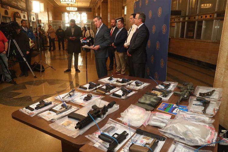 Guns on display at Police HQ as Erie County DA John Flynn talks