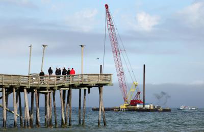 Efforts to retrieve the car, that drove down and off the Virginia Beach Fishing Pier the day before, were thwarted Sunday, Jan. 28, 2024.