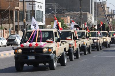 Celebrations after the withdrawal of US-led coalition forces from Iraq, in Najaf