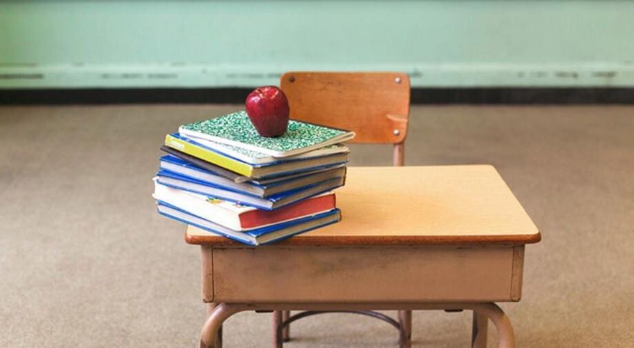 School desk and blackboard