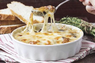 Mushrooms gratin with cream, cheese, French dish julienne