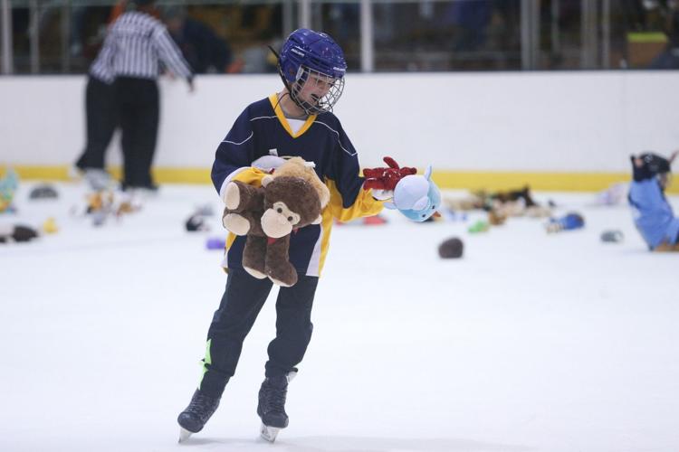 Annual 'Teddy Bear Toss' collects hundreds of stuffed animals at hockey  game | Local News 