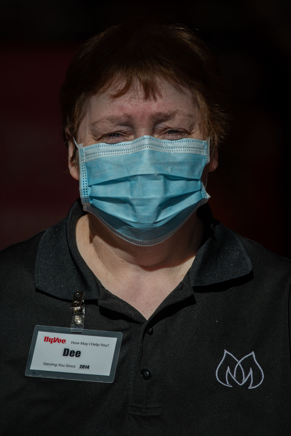 Dee Green, employee at Hy-Vee, stands in the entrance of the store with the carts sheÕs cleaned. Come August, Green will have been working at Hy-Vee for 6 years. ÒItÕs different you know, thereÕs a big pandemic right now so IÕve been doing what I can to keep everybody safe by keeping the carts clean,Ó said Green.