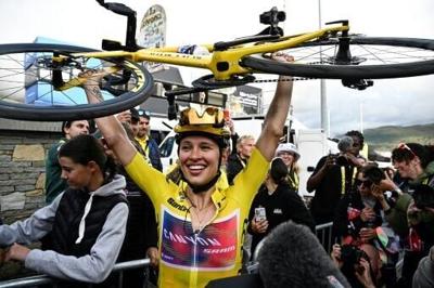 Katarzyna Niewiadoma celebrates after winning her maiden women's Tour de France crown