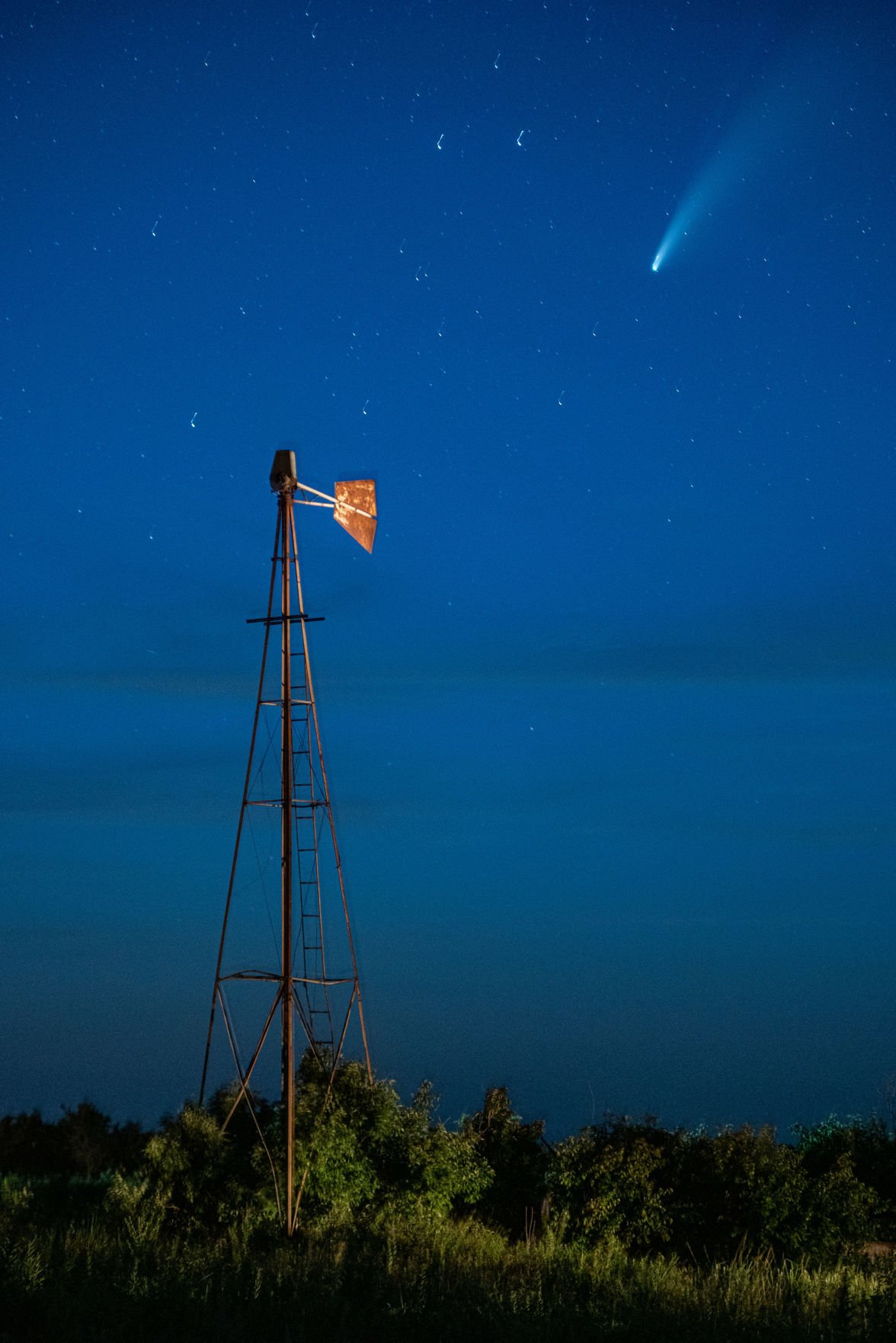 Comet NEOWISE or C/2020 F3 flies above a windmill just north of Highway 16 on Shannon Creek Road at 10:23 p.m. The comet was first identified by the infrared-optimized NEOWISE spacecraft (short for Near-Earth Object Wide-field Infrared Space Explorer) on March 27, 2020 and will be visible to the naked eye until the end of July 2020. Comet NEOWISE can be found under the Big Dipper when looking in the Northwest direction. Comet NEOWISE is traveling at a speed of 17,500 miles per hour and wonÕt be visible for another 6,800 years.