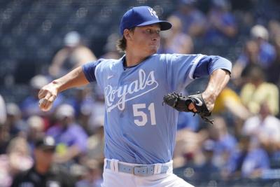 Kansas City Royals starting pitcher Brady Singer throws during the