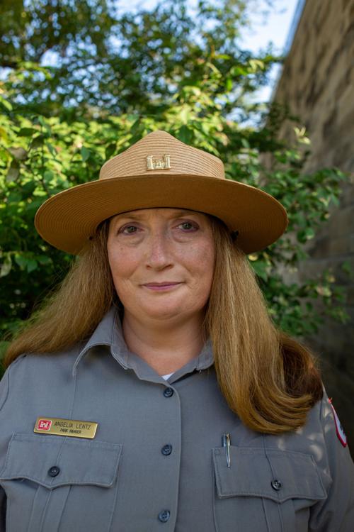Angelia Lentz, park ranger, smiles outside of office. Her favorite aspect of her job is educational programs in the community such as water safety and the history of the lake.