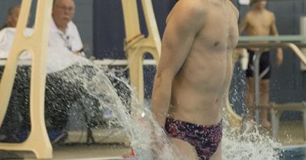 Manhattan's Zeke Kohl lands his dive during the state swimming and diving  meet